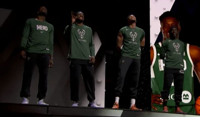 坚毅的眼神！末节垃圾时间 狄龙坐在板凳上冷静盯着镜头（末节垃圾时间，狄龙板凳席冷静直视镜头，目光坚毅）